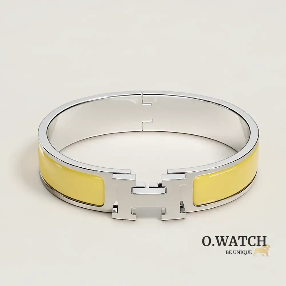 BRACELET HERMES CLIC H JAUNE D'OR ARGENTÉ