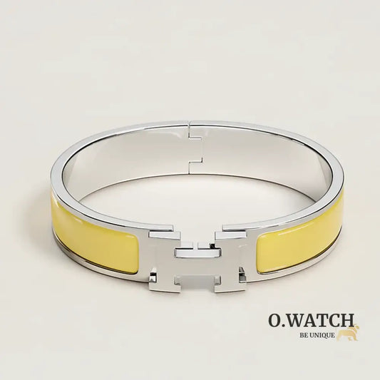 BRACELET HERMES CLIC H JAUNE D'OR ARGENTÉ